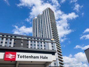 A modern building with a sign for Tottenham Hale. - Access Great Venues, Airports, cLDN, Tottenham hale station apartment W/Parking! (London)
