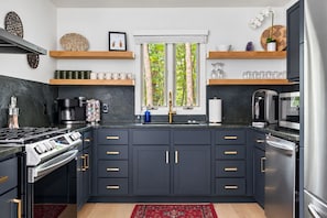Prepare favorite meals before heading out for the day - Saugatuck Escape | Hot Tub • Walkable • Designer! (Saugatuck)