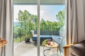 Living area - Secluded house on 12 acres, set in the tree canopy, loch views and private beach (Strathtumel)