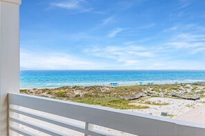 A balcony with a view of the beach and ocean. - Amberjack (Panama City Beach)