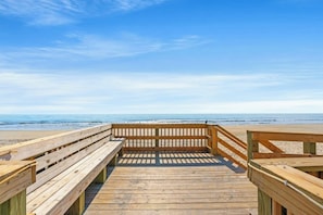 A wooden boardwalk leading to a beach with a clear sky. - Myrtle Bch Renaissance 2107-Ocean View Efficiency (Myrtle Beach)