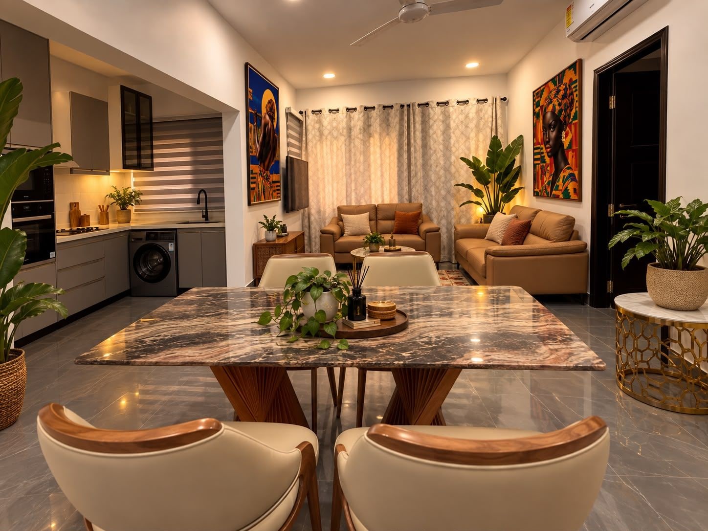 A modern living space with a dining area, kitchen, and seating area.