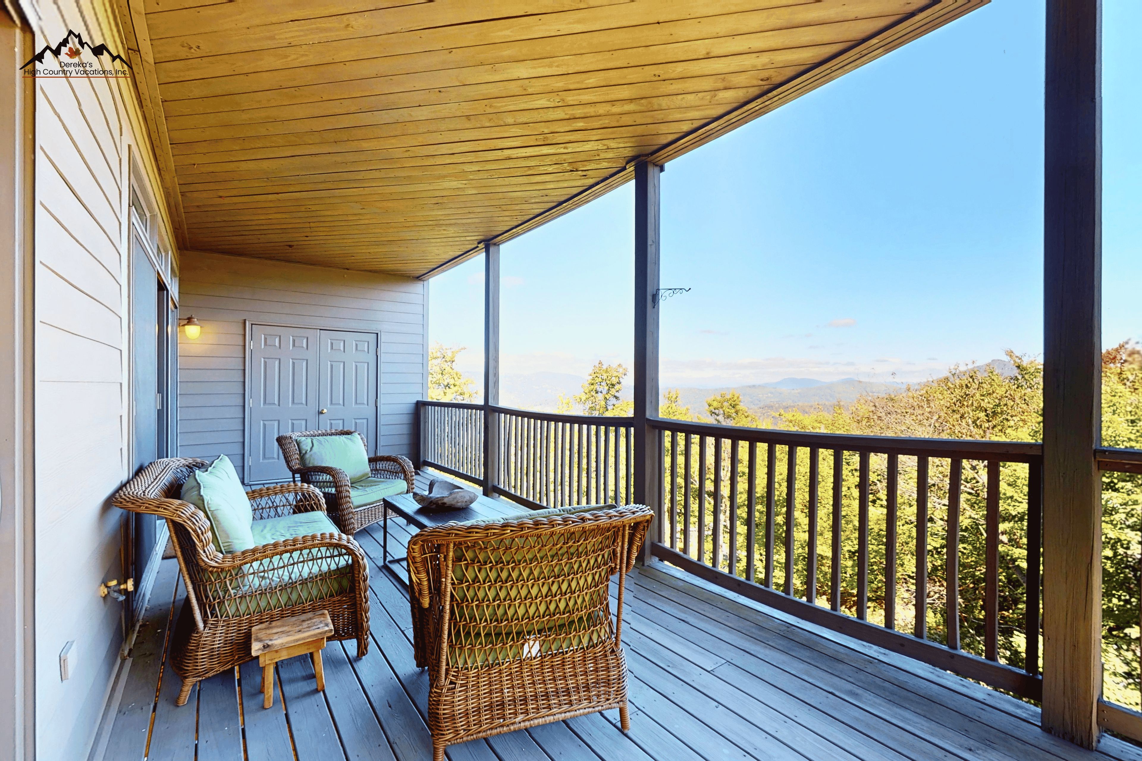 Sip your morning coffee from your private covered deck, where treetop-level views of the surrounding mountains create a peaceful escape. The wicker seating and warm wood ceiling invite you to unwind with the scenery stretched out before you.
