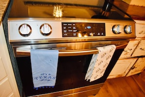 A stainless steel oven with a digital control panel displaying various cooking functions. - Beautifully Restored 1913 Home in Historic West, 3BR/2BA, Near Baylor (West)