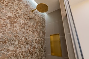 A bathroom with a shower area, a wall-mounted towel rack, and a glass shower enclosure. - San Francesco Boutique House by Wonderful Italy (Turin)