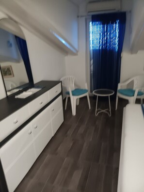 A room with a bed, a dresser, two chairs, a small table, and a window with curtains. - Apartments Azuro (Dugi Rat)