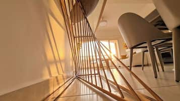 A modern interior with a staircase featuring a unique geometric design.