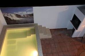 A spa area with a hot tub and a view of a waterfall. - La Bienservida Country House (Bienservida)