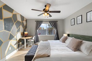 A bedroom with a bed, a desk, a chair, a ceiling fan, and a window with curtains. - The Hermosa House - Tempe Getaway- Relax (Tempe)