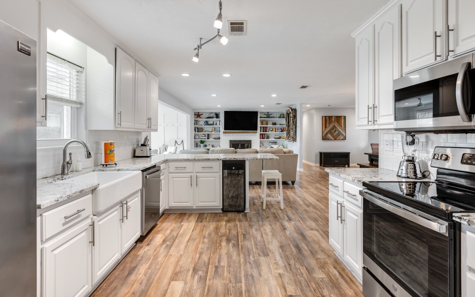 Well-appointed for dining and entertaining, with abundant space and a dedicated wine cooler for chilled favorites.