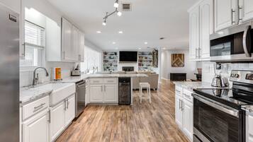 Well-appointed for dining and entertaining, with abundant space and a dedicated wine cooler for chilled favorites.