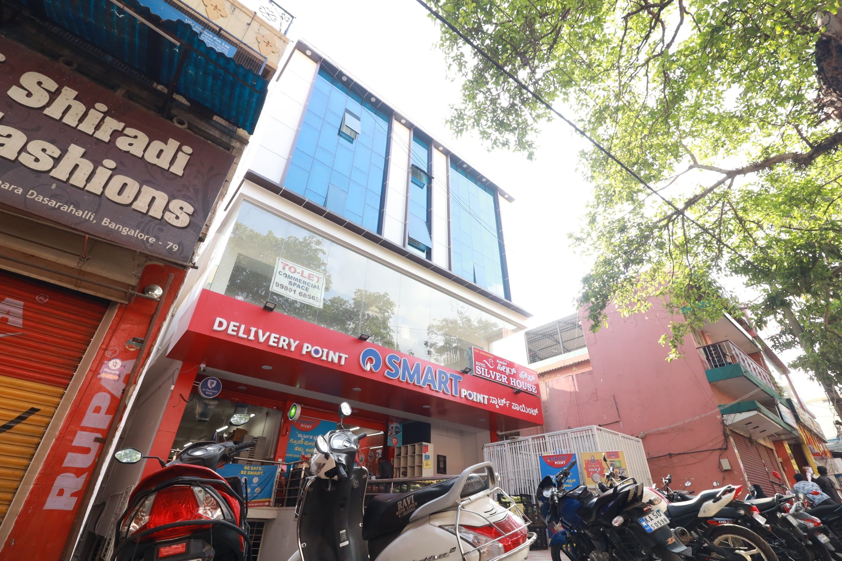 A commercial building with a delivery point and a sign for a hotel.