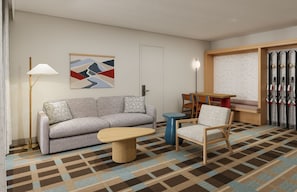 Een moderne hotelkamer met een bank, een klein rond tafeltje, een stoel, een vloerlamp, een ski-rek en een schilderij aan de muur.