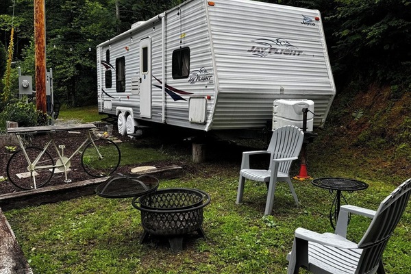 camper with small firepit area
