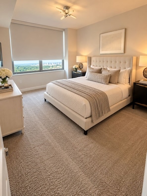 A bedroom with a large bed, a nightstand, a dresser, a window with a view, and a ceiling fan. - The Skyline Retreat @ Atlantic Station - Rooftop Pool & Gym (Atlanta)