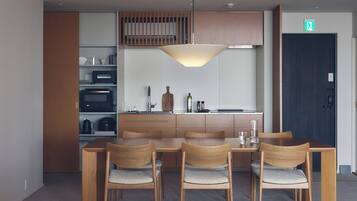 A modern kitchen with a dining area.