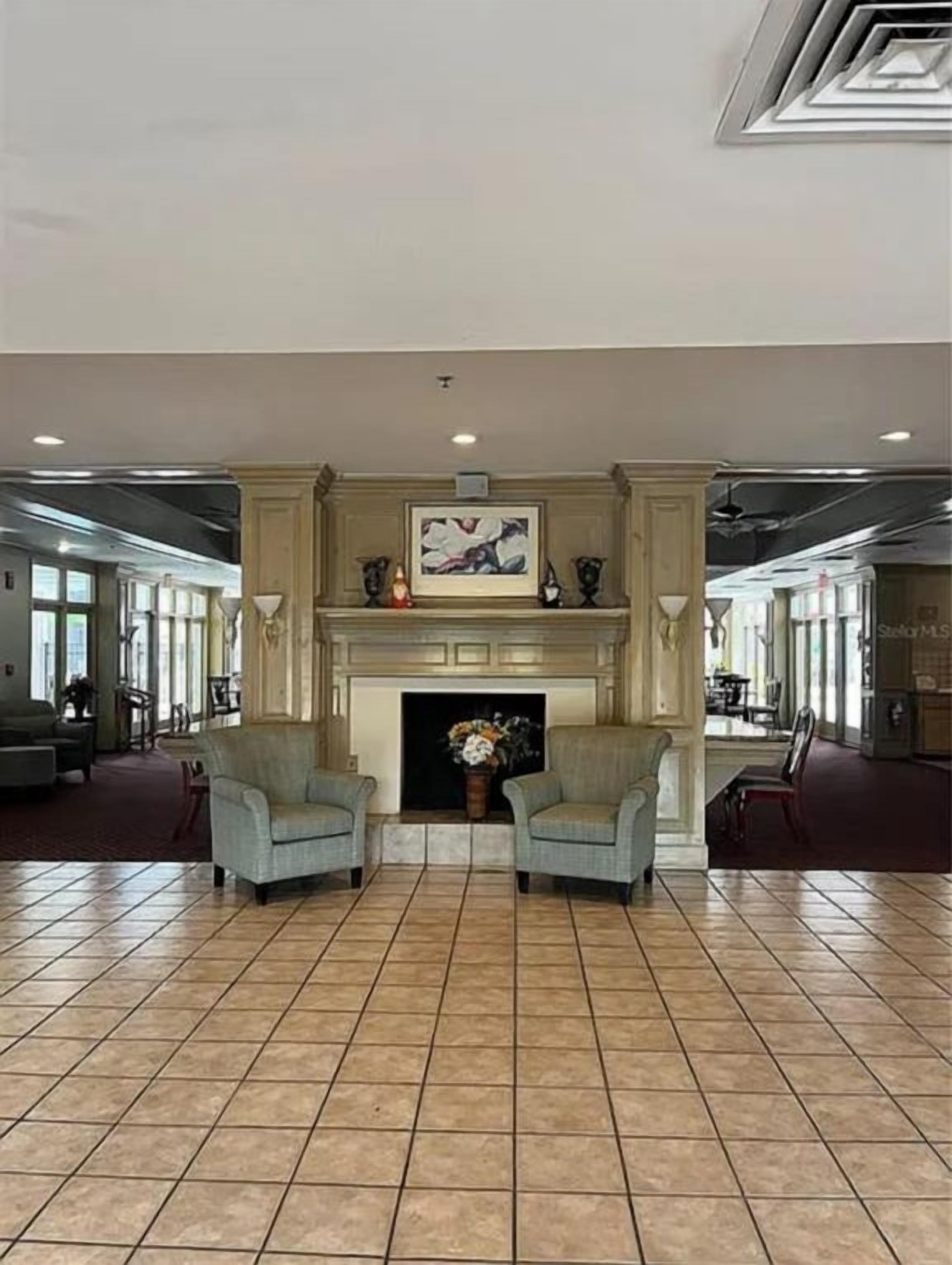 Elegant lobby features a decorative fireplace and inviting seating for a warm welcome when you arrive.