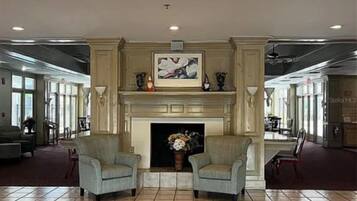 Elegant lobby features a decorative fireplace and inviting seating for a warm welcome when you arrive.