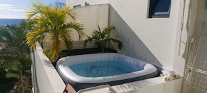 An inflatable hot tub on a rooftop terrace with a view of the sea. - Indigo Sweet is a highly rated 1-bedroom apartment located in Indigo Bay. (Cole Bay)