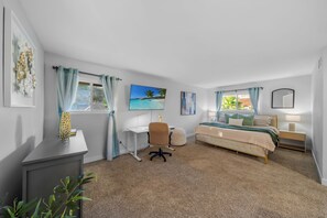 A bedroom with a bed, desk, chair, and a window with curtains. - Entire Private House with 4 Beds, Pool, Hot Tub, King Bed, Garage, Grand View (San Diego)
