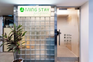 A gated entrance to a property named 'MING STAY' with a sign indicating check-in at PM 03:00 and check-out at AM 11:00. - MING STAY Gangnam (Seoul)