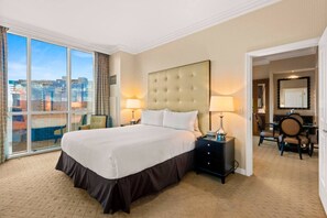 A hotel room with a large bed, a desk, a chair, and a view of the city through large windows. - 38 Floors Above Vegas | Epic Strip Views (Las Vegas)