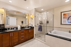 A modern bathroom with a large mirror, a walk-in shower, and a separate bathtub. - Vegas Sky Suite | Extended Balcony + Strip Views (Las Vegas)