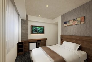 A hotel room with a bed, a desk, a television, and a wall-mounted artwork. - SmileHotelPremium Tottori (Minami-Yoshikata, Tottori-shi, Tottori)