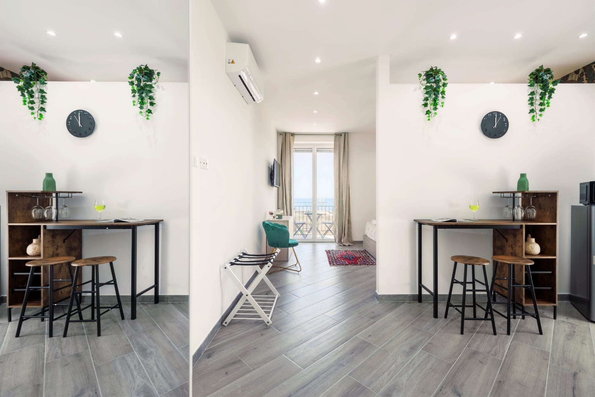 Een moderne keuken met twee barkrukken, een eettafel en uitzicht op het balkon.