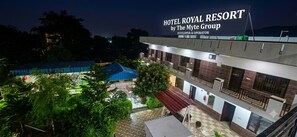 A multi-story hotel with a sign reading 'Hotel Royal Resort by The Myte Group'. - Hotel Royal Resort By The Myte Group (Katra)