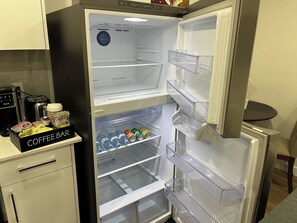A kitchen with a refrigerator, coffee bar, and a toaster. - Cozy Retreat with Private Entrance in Edmonton (Edmonton)