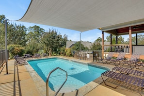 A swimming pool with a shaded area, lounge chairs, and a covered seating area. - Pool, Hot Tub & Dock: Lake Hartwell Home (Anderson)