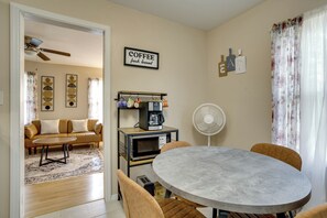 A compact living space with a dining area, a coffee station, and a ceiling fan. - 5 Mi to Dtwn & Bricktown! Quaint Escape (Oklahoma City)