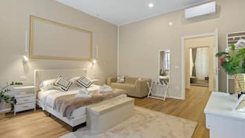 A modern bedroom with a bed, bedside tables, a bench, a mirror, and a wardrobe.