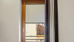 A door with a view of a building's exterior through a window. - Love Story - inclusa ricca colazione a buffet (Cormons)