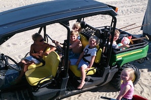 A vehicle with children seated inside, a steering wheel, and a visible brand name on the side. - Holiday home with 2 bedrooms (Vrouwenpolder)