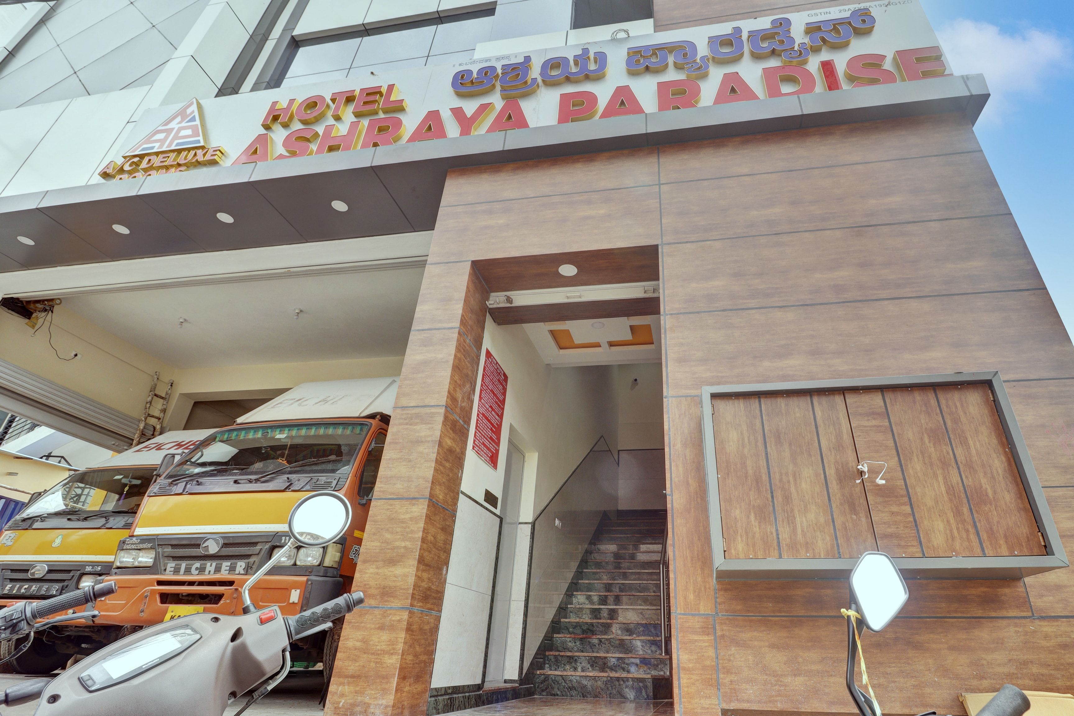 The entrance to Hotel Ashiraya Paradise with a staircase leading to the entrance.
