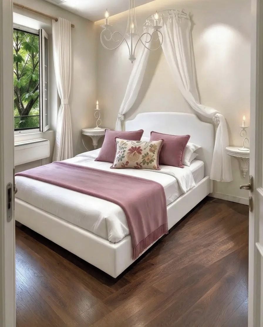 A bedroom with a bed, curtains, a chandelier, and a window with a view of greenery.