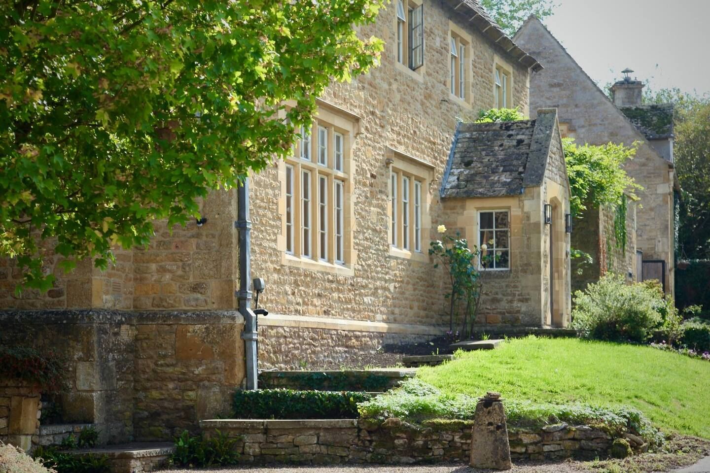 Grand stone entrance to the main house, tucked away in a peaceful village lane