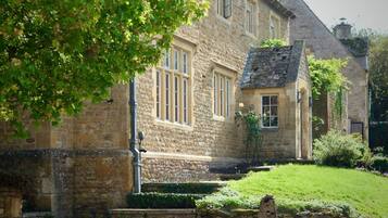 Grand stone entrance to the main house, tucked away in a peaceful village lane