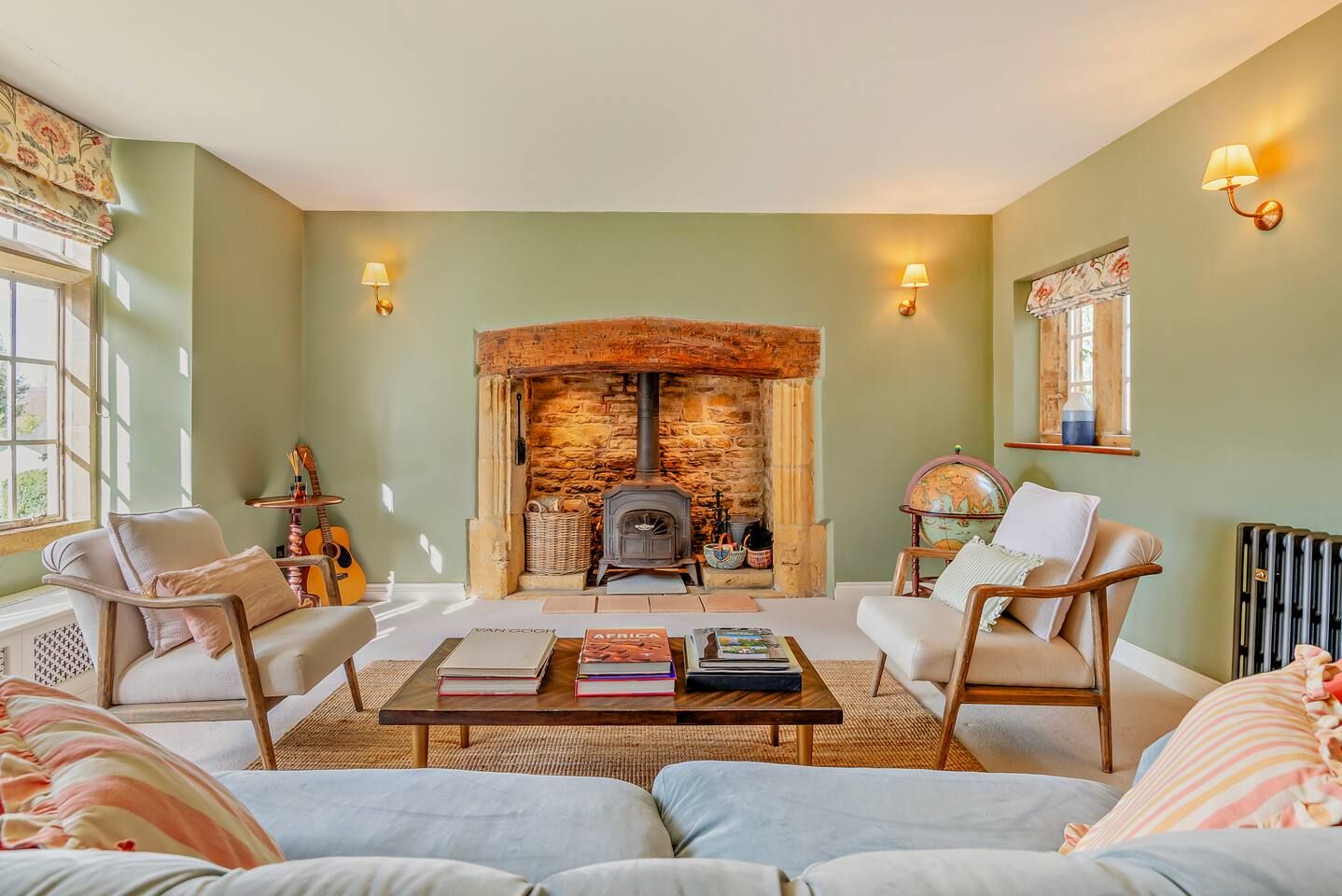 Principle living room with inglenook fireplace and wood-burning stove