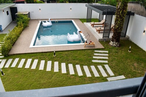 Luxurious villa in Bingerville with a pool, rooftop, and lagoon views