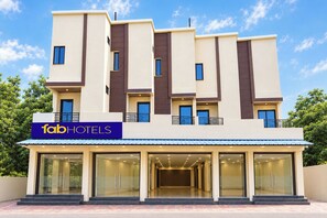 A modern hotel building with a flat facade, multiple balconies, and a prominent sign for 'fab hotels'. - FabHotel Fortune Tulsi Nagar (Indore)