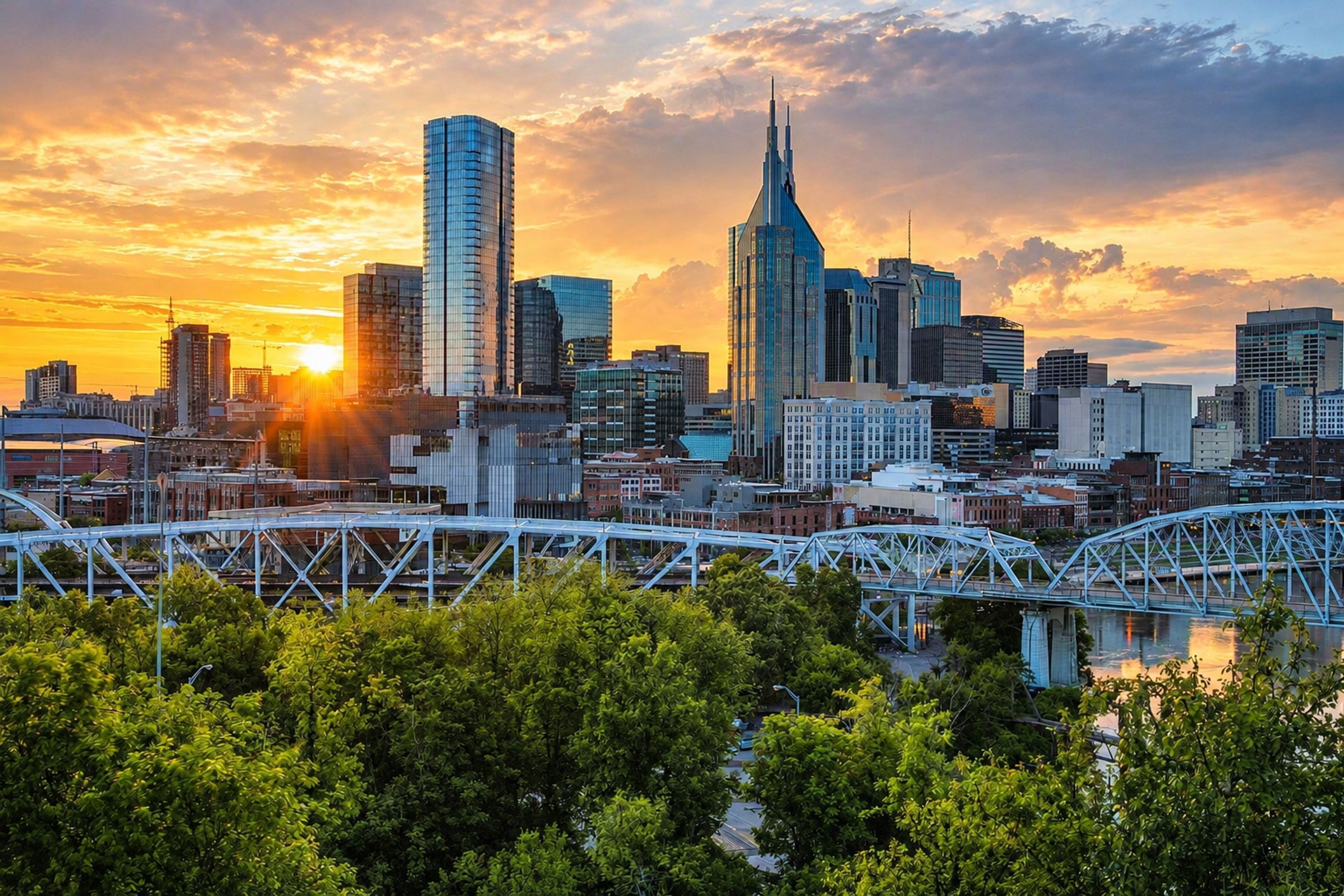 A city skyline with modern buildings and a bridge in the foreground.