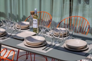 A table set for dining with plates, glasses, and cutlery. - Anassa House with Rooftop Jacuzzi (Gavalochori)