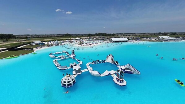 A water park with multiple swimming areas and water slides.