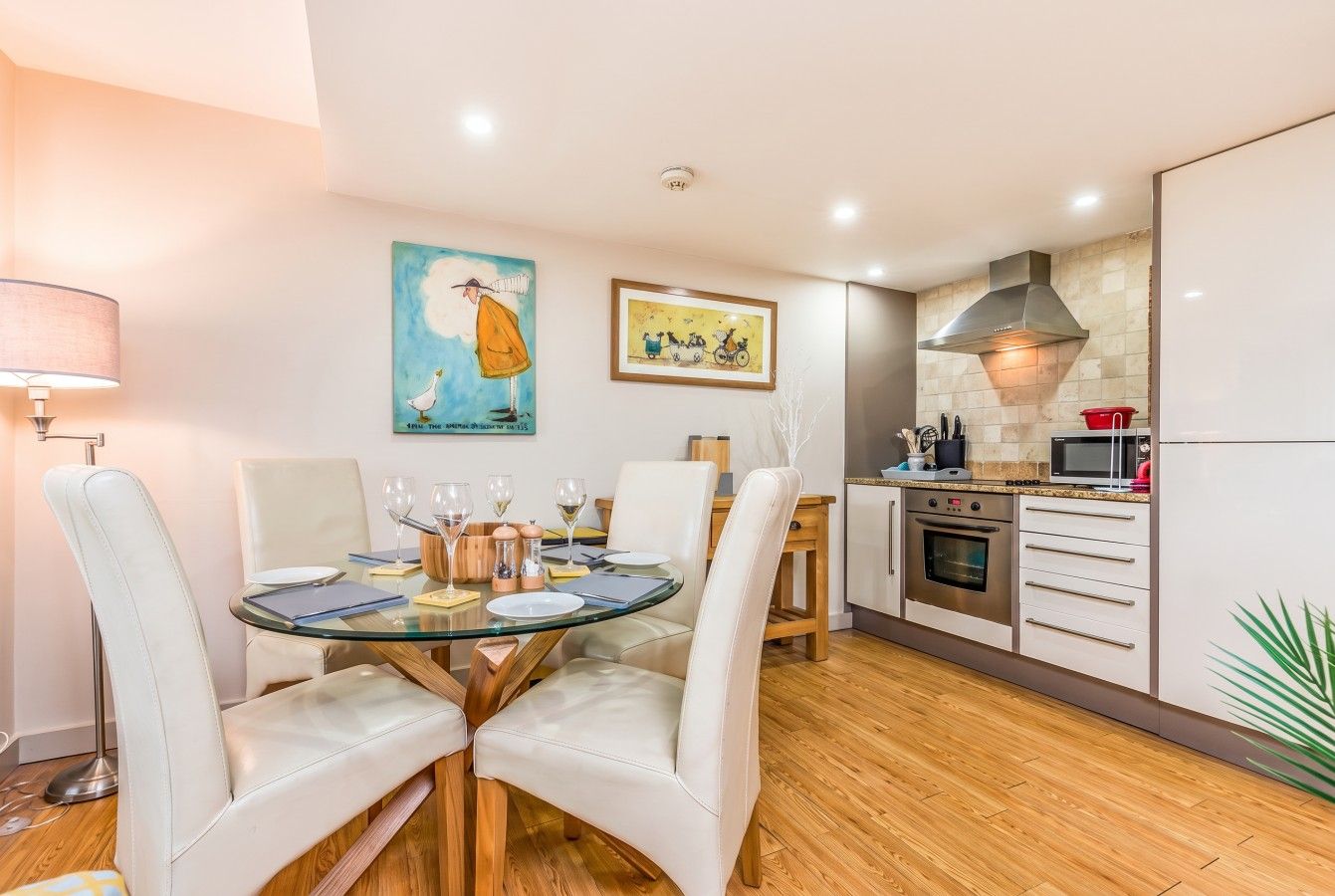 A modern kitchen with a dining area.