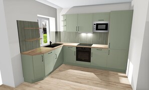 A modern kitchen with green cabinets, a microwave, an oven, and a wooden countertop. - Schmiede II - Vacation Home for 8 People, 4 Bedrooms & Garden (Dagebüll)