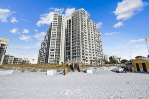 A high-rise hotel with multiple balconies, located on a sandy beach with clear skies. - 🌴Sandestin Gulf FRONT~Covered Balcony~Pool-Amazing Views@Beachside Two🌴 (Miramar Beach)