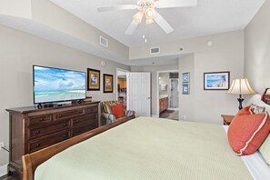 A bedroom with a bed, dresser, television, and a ceiling fan. - ⭐Gulf Views -2 Pools + Kids Fountain-3BR Ariel Dunes I 610-Emerald Eden⭐ (Miramar Beach)